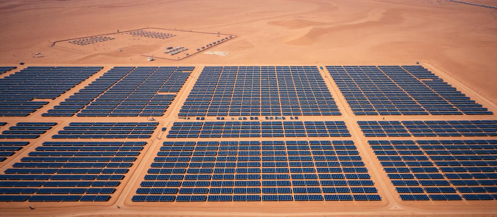 Aerial view of a utility-scale solar plant in the Saudi Arabian desert